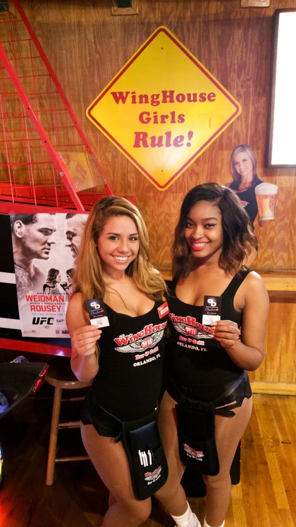 Two women holding SIBABES cards in the first SIBABES photograph from 2015.