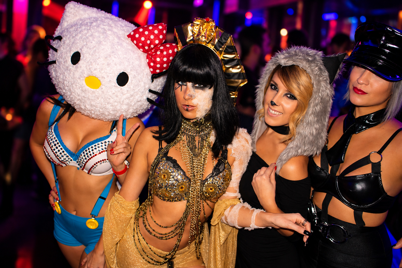 Four women in Halloween costumes from the SIBABES archives.